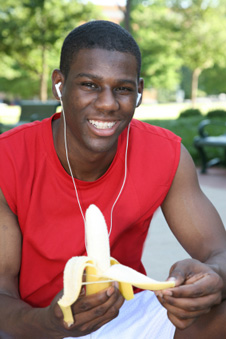 young man peeling a banana