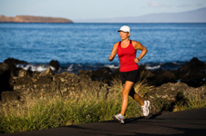 woman jogging along the coast