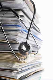 stack of papers, stethoscope