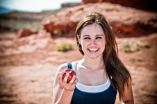 woman outdoors with apple