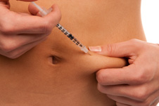 inyección de insulina en el abdomen